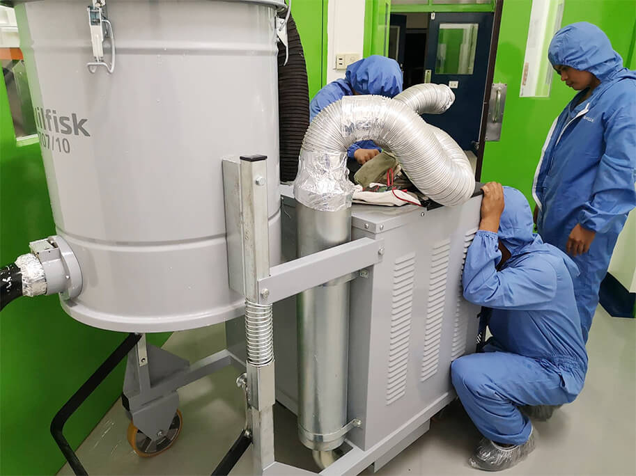 Loveair services technicians working on an industrial pump